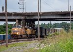 A southbound freight begins to crawl out of Riverfront Yard